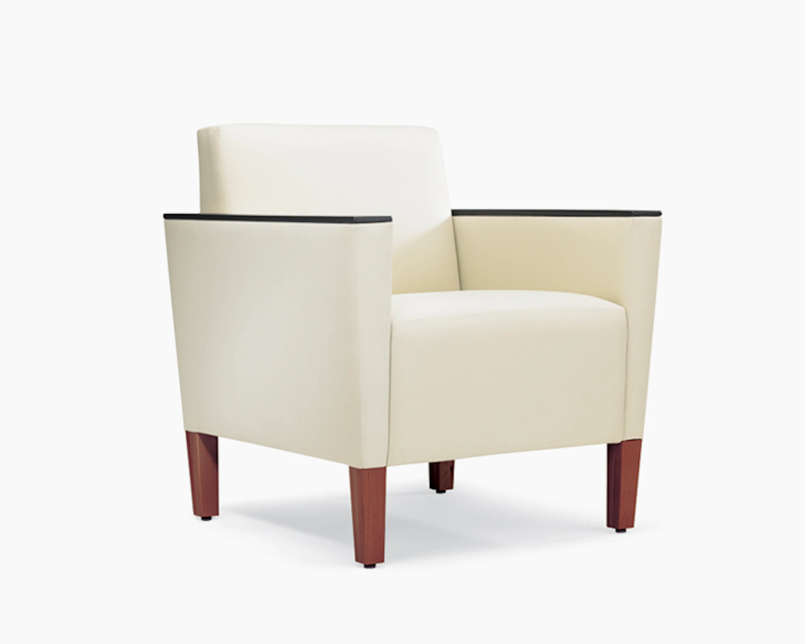 A three-quarter view of a Brava Classic Lounge Chair with white textile and urethane arm caps.