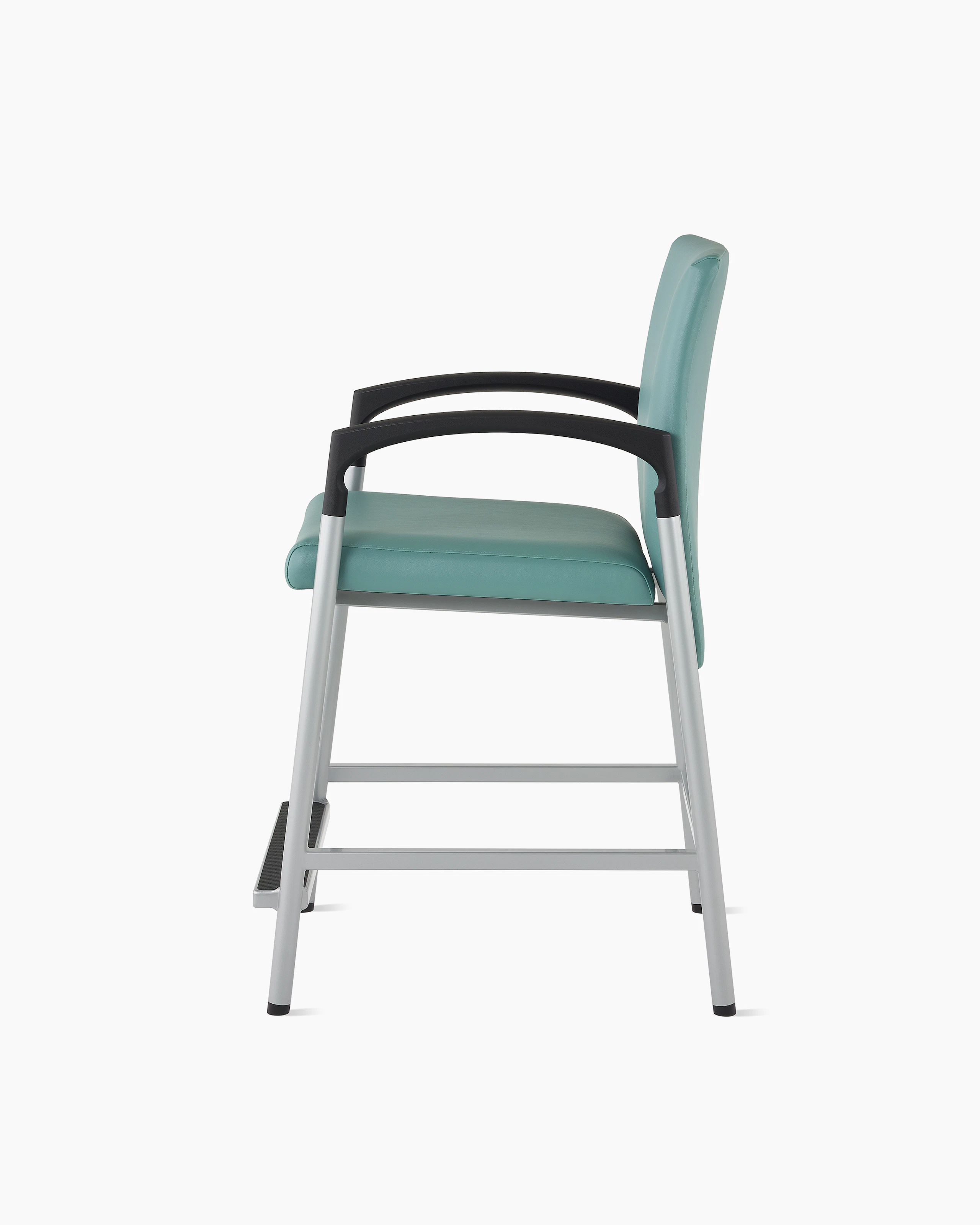 Side view of a Valor Easy Access chair in a blue-green upholstery with a silver frame and black armcaps on white sweep.