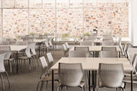 Knoll Antenna simple tables with black legs and MultiGeneration by Knoll chairs for a café