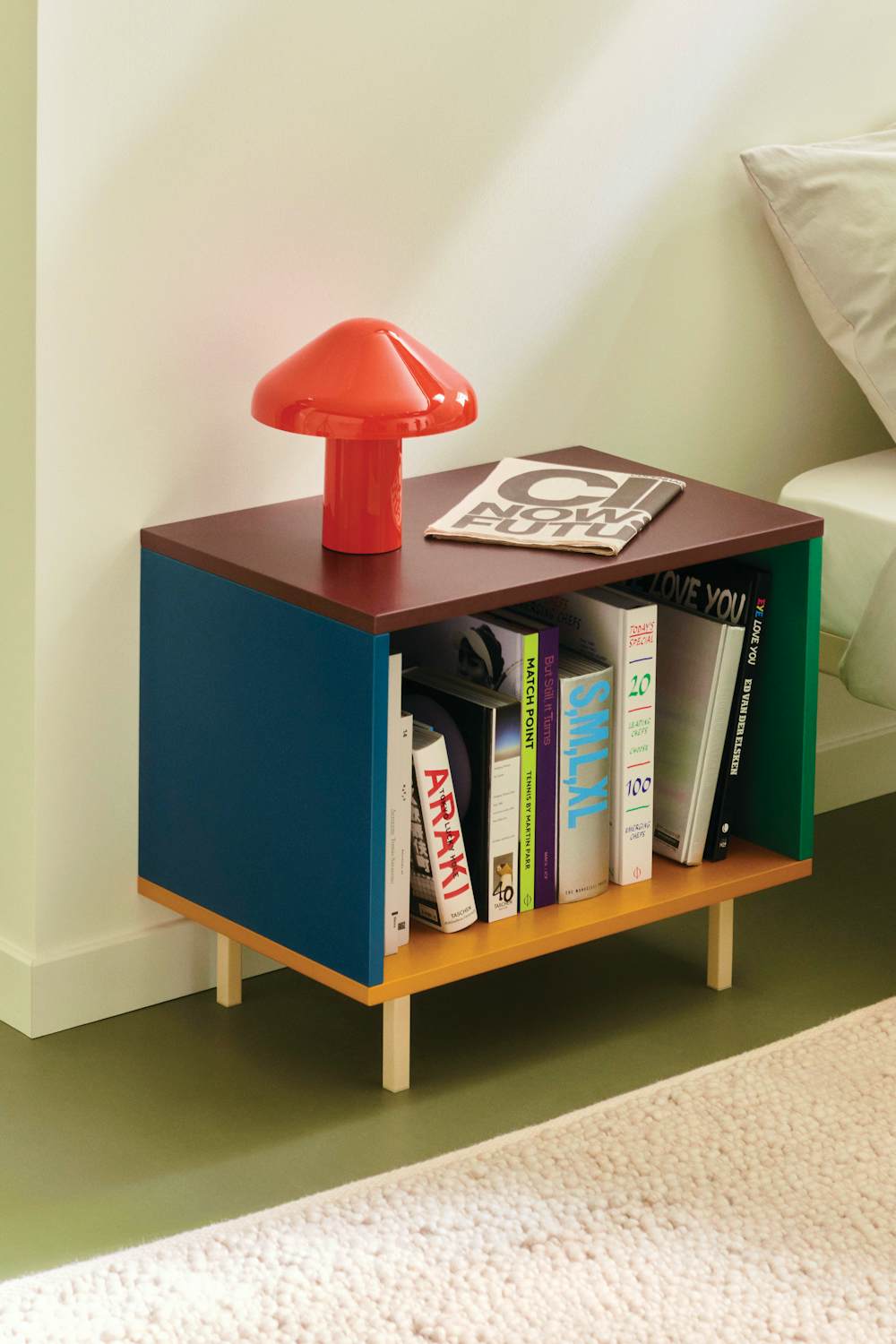 Pao Portable Mushroom Lamp on top of a Color Cabinet in a bedroom setting