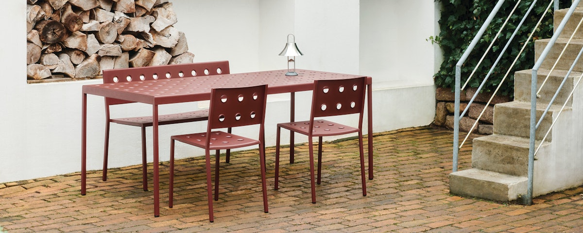 Balcony Chairs and Balcony Dining Table in an outdoor courtyard setting