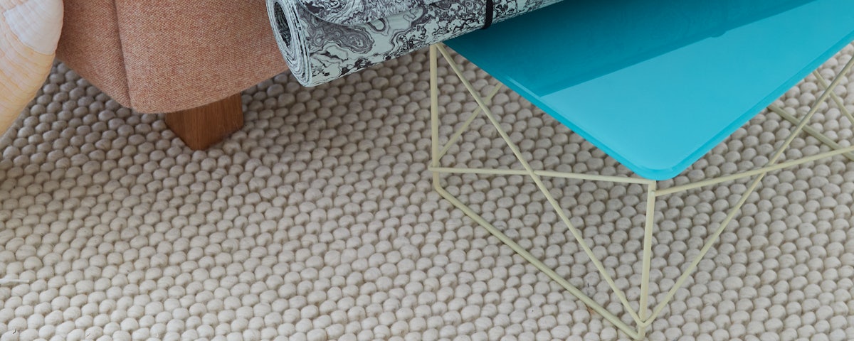 Pirta Handloom Wool Rug in a bedroom setting
