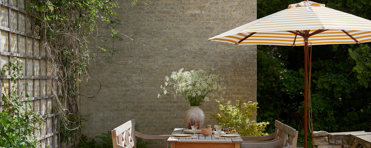 Messina Circle Umbrella in an outdoor patio setting