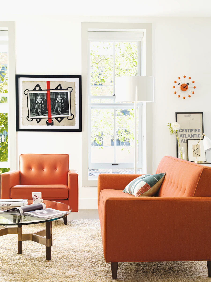Orange Bantam armchairs in living room