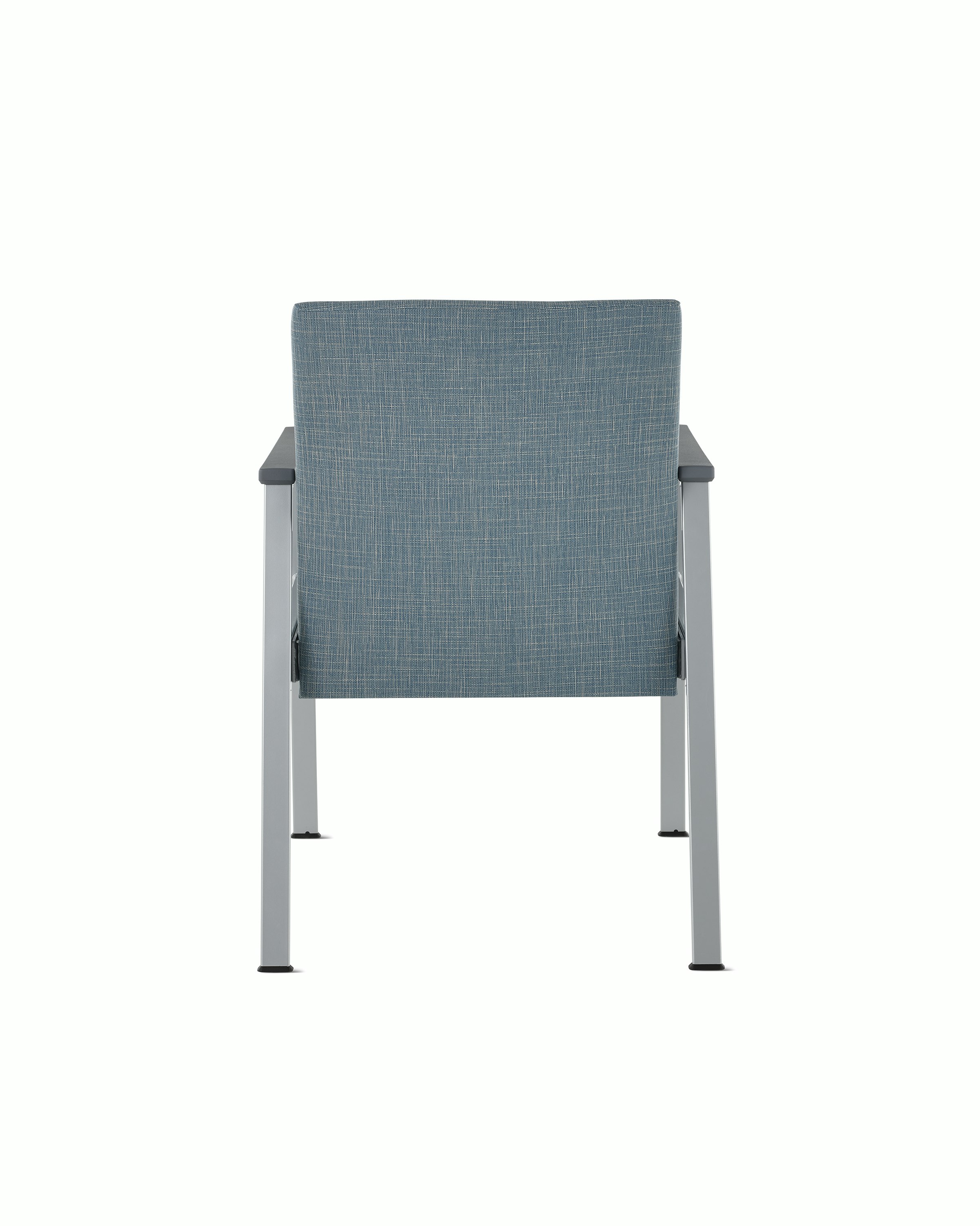 Rear view of an Easton Side Chair with blue upholstery, metallic silver four leg base and slate grey arm caps.