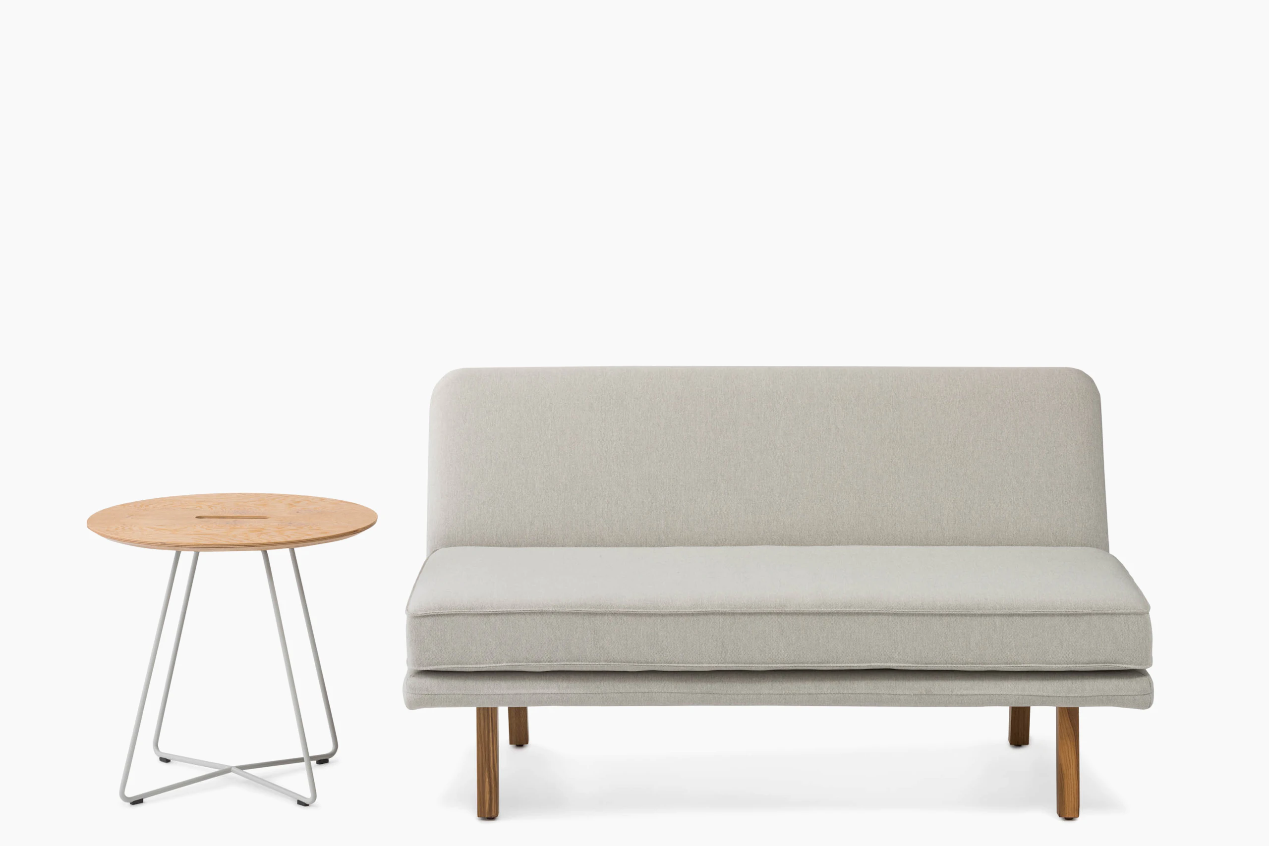 rockwell unscripted armless settee occasional round side table