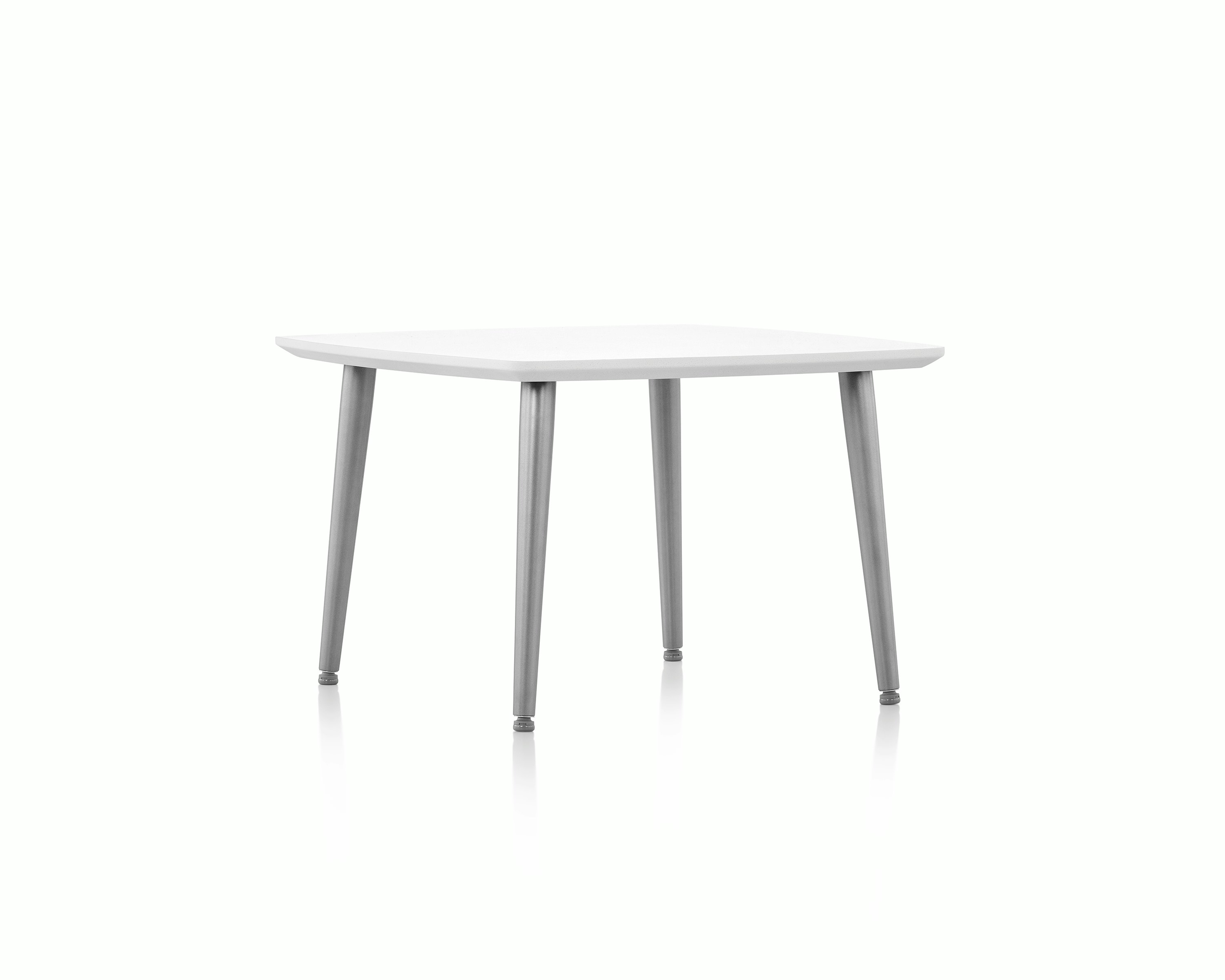 Palisade Occasional Table with metal legs and solid surface top on white sweep.