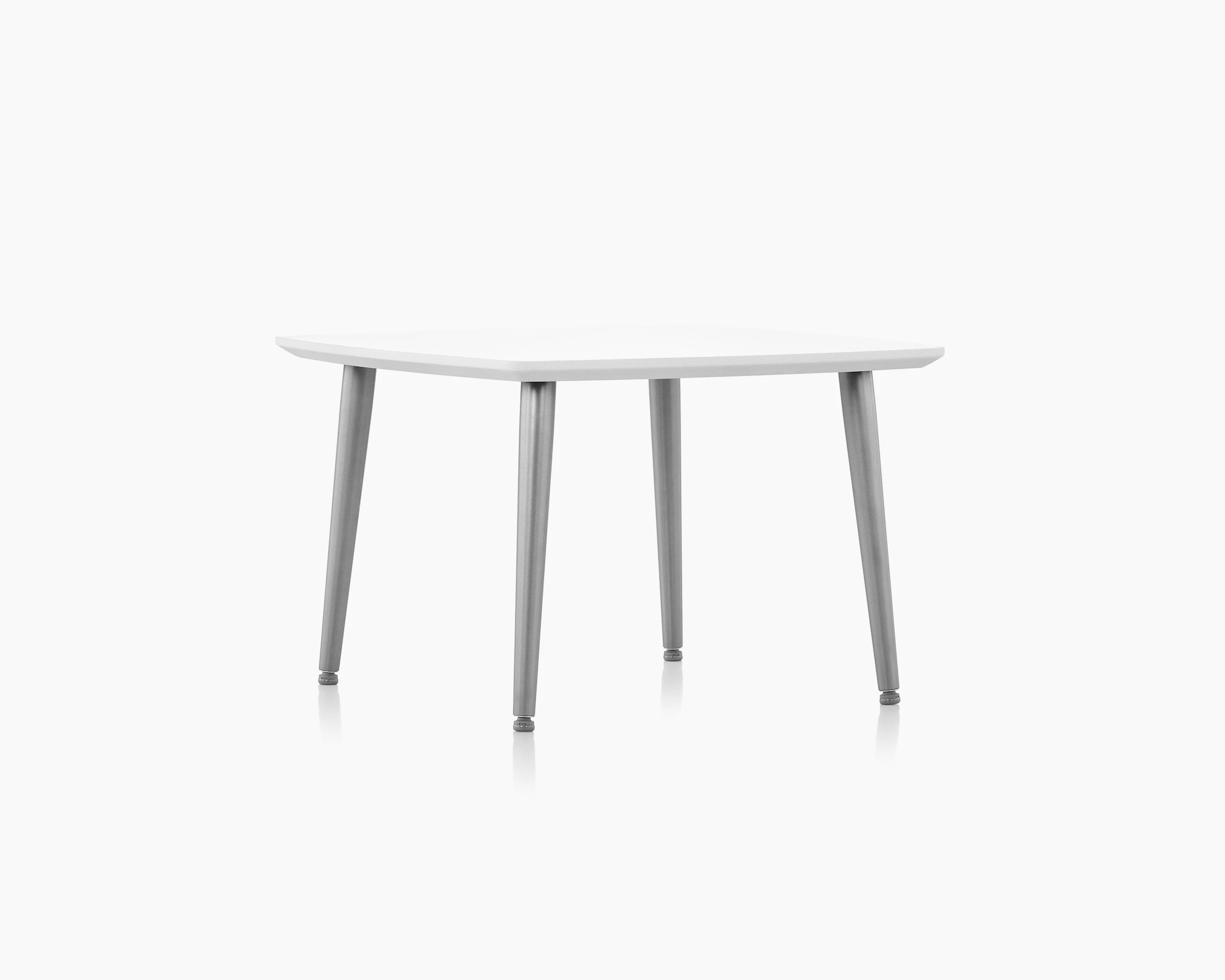 Palisade Occasional Table with metal legs and solid surface top on white sweep.
