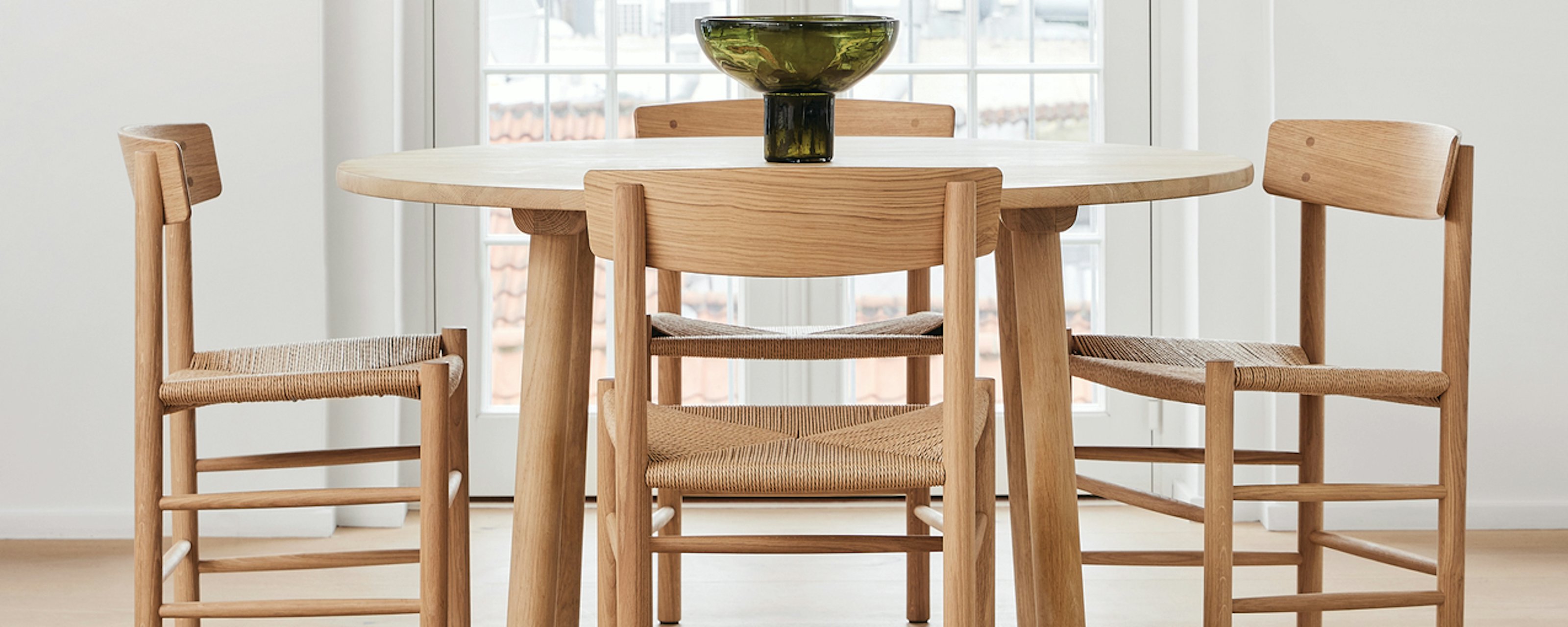 Four J39 Dining Chairs around a dining table in a dining room setting