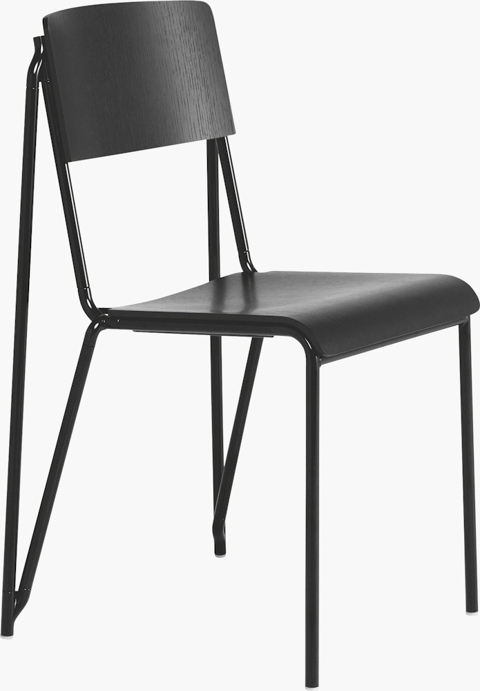 A three quarter side view of a black Petit Standard Chair.