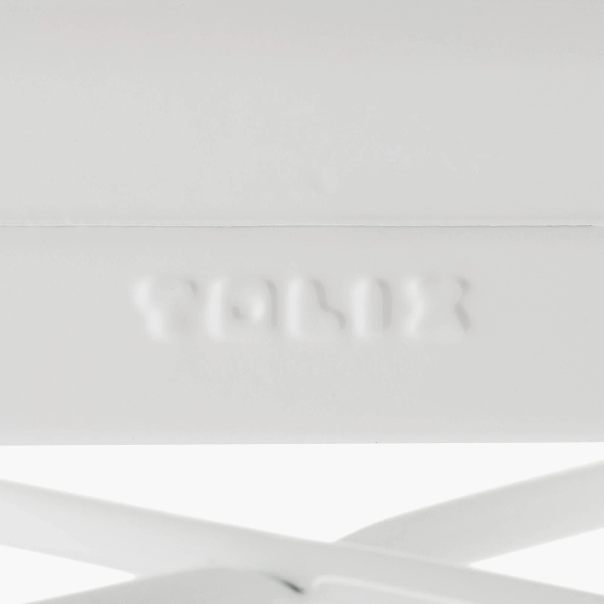 White Tolix-style stool base and legs detail