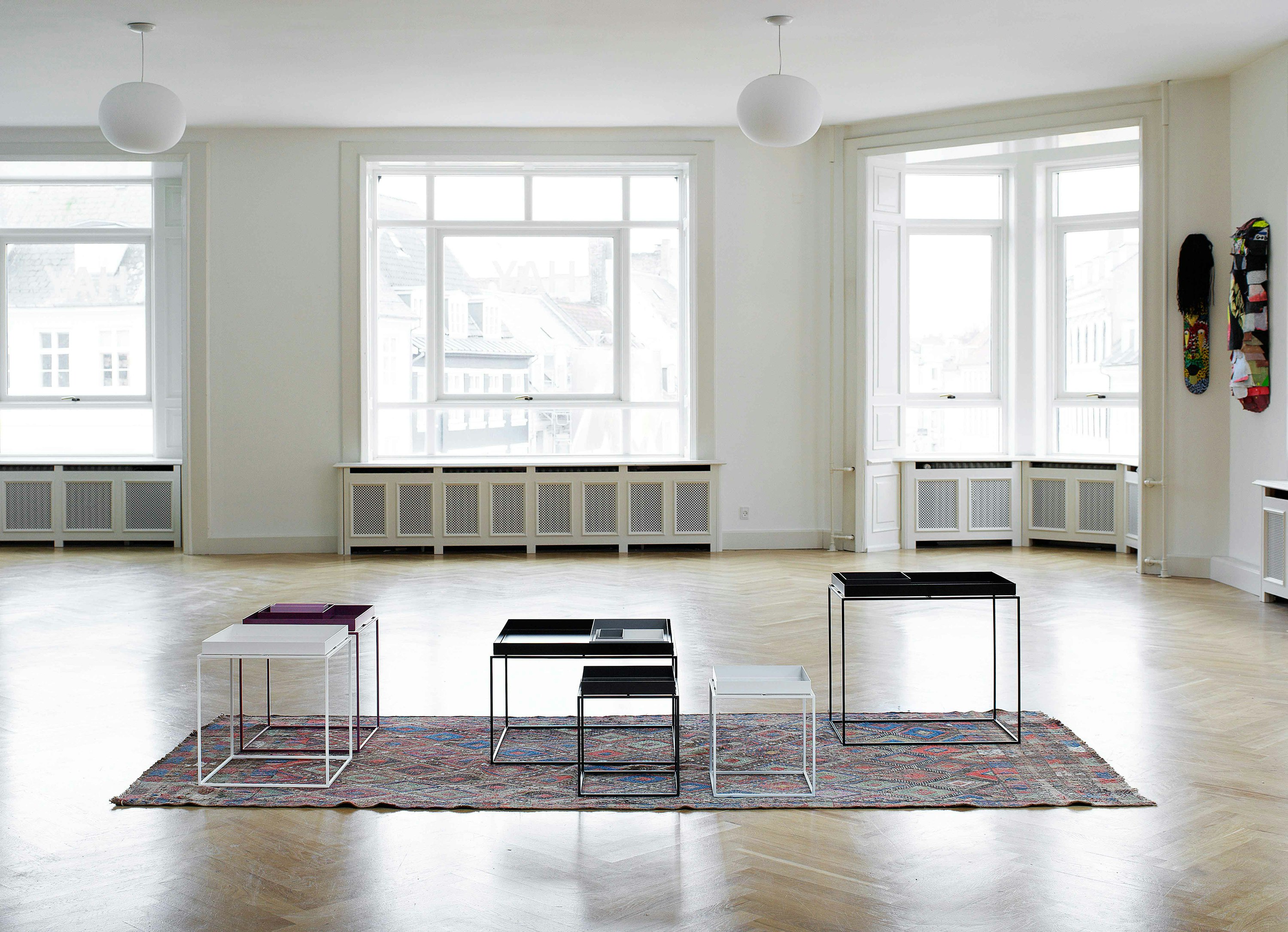 Tray Table family collection staged on a rug in a large open room.