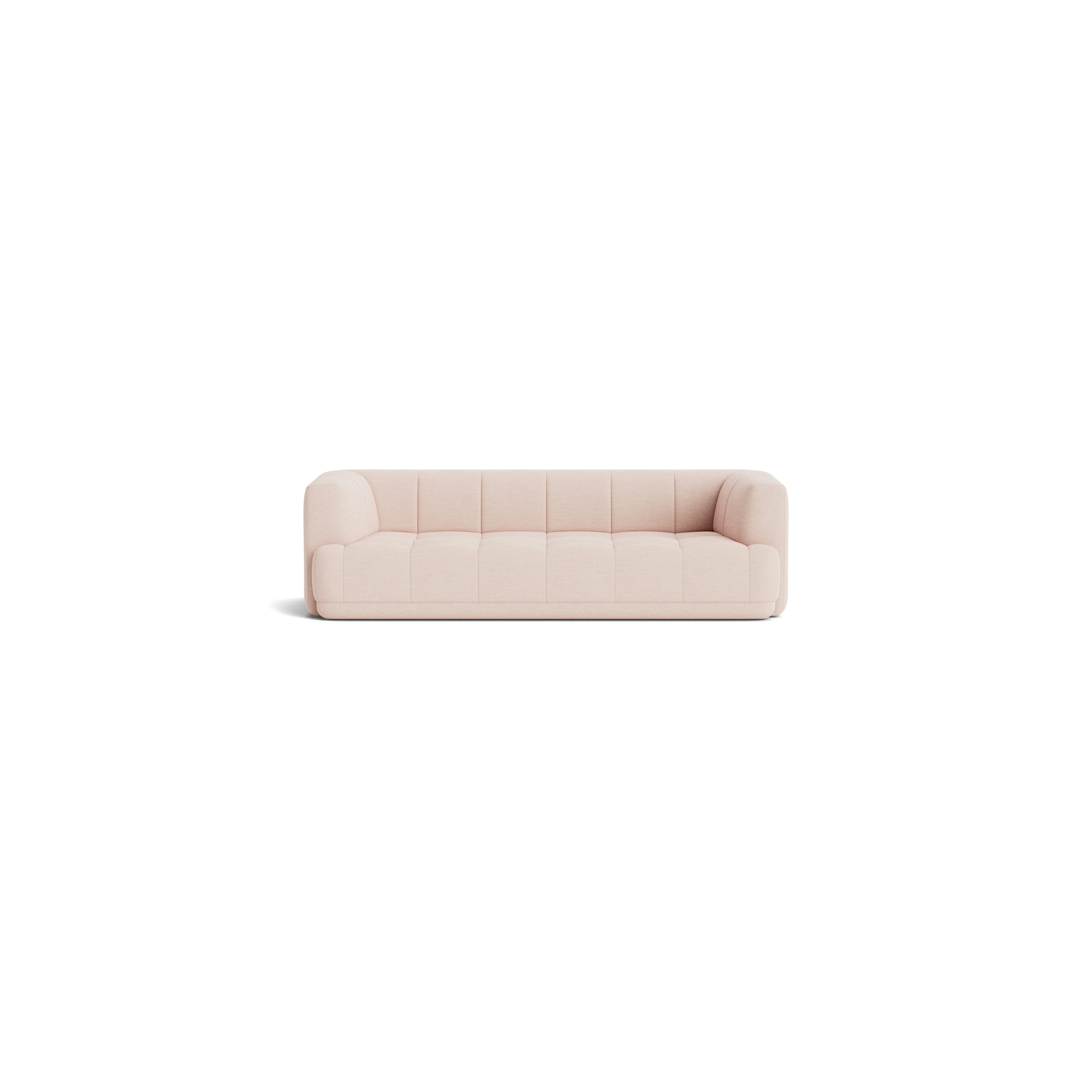 A front view of the Quilton Sofa in light pink.