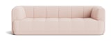 A front view of the Quilton Sofa in light pink.