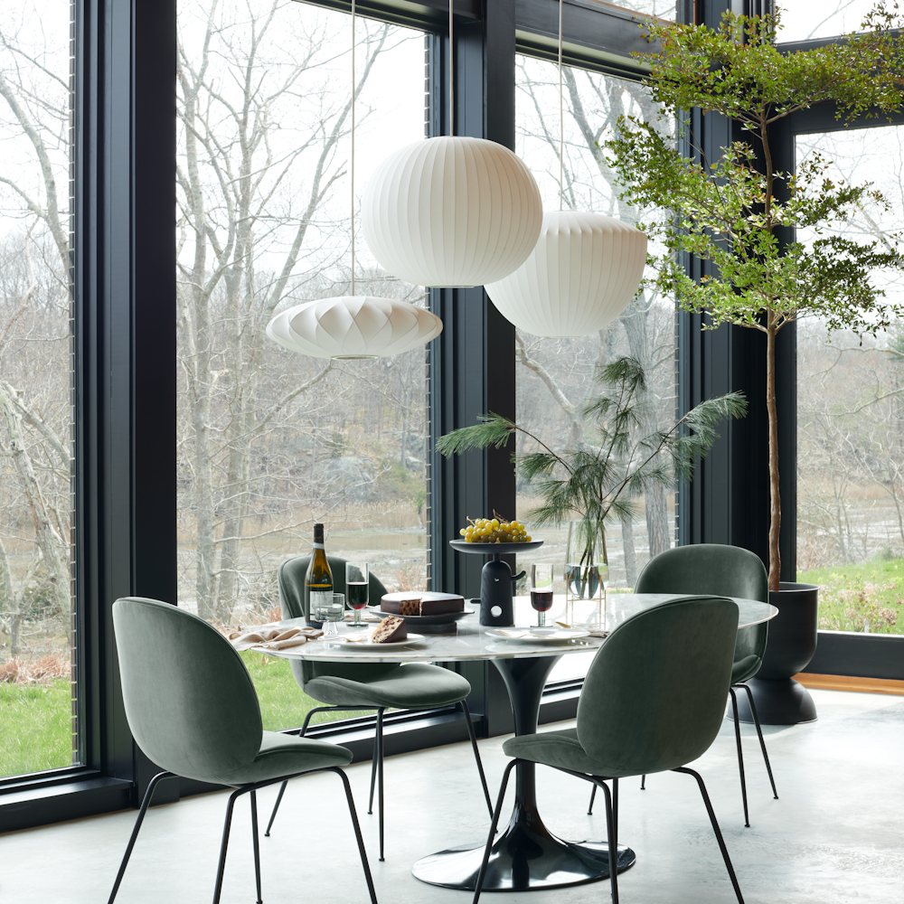 Saarinen Dining Table and Beetle Side Chair in a dining room setting