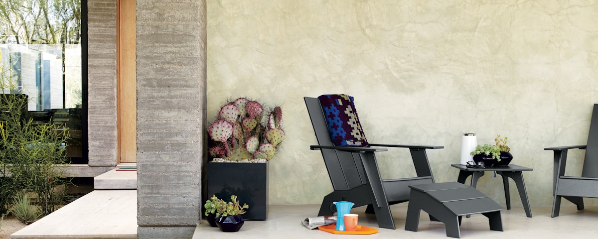 Adirondack Chairs, Ottoman and Side Table in outdoor patio setting