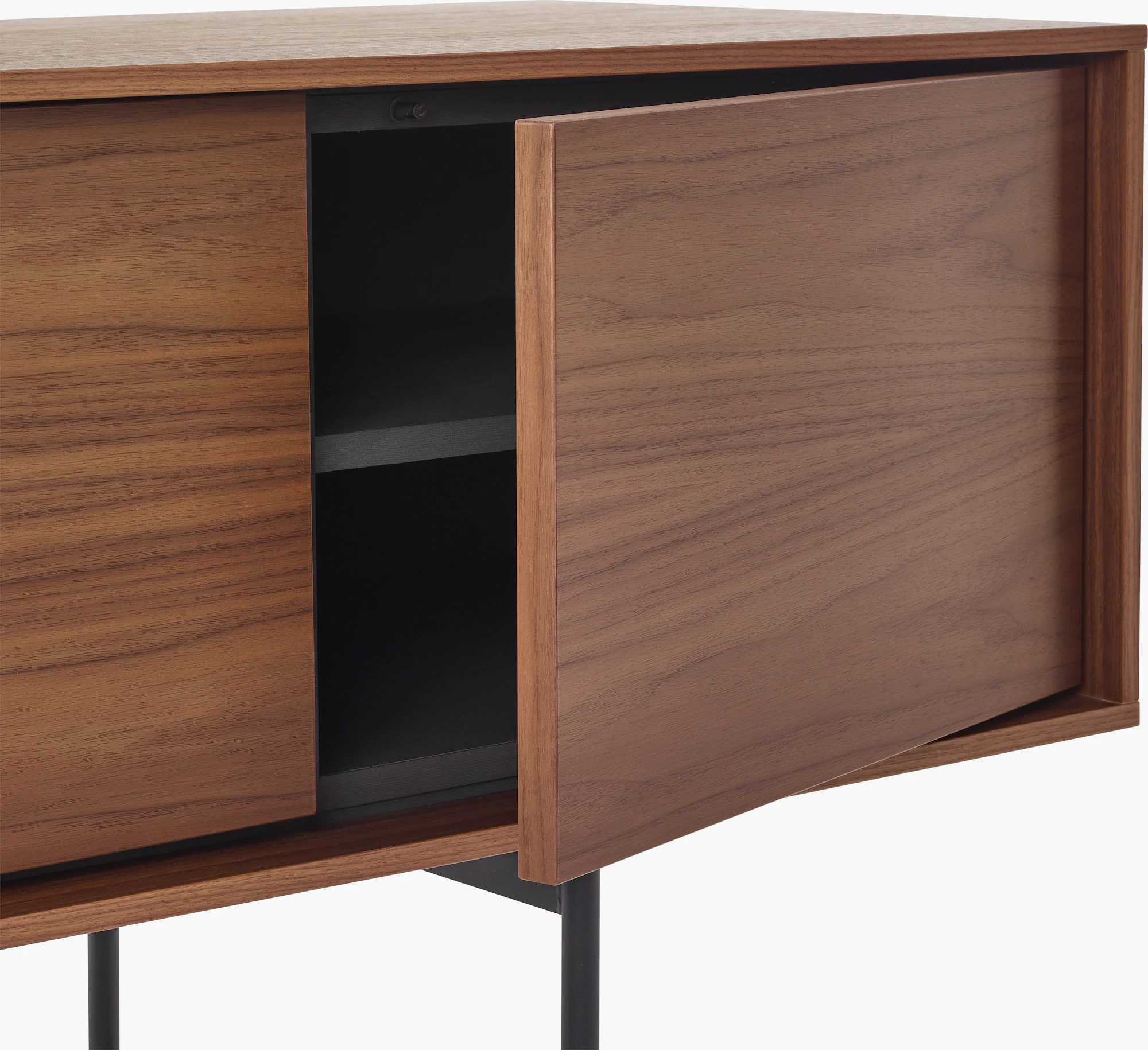 Aura credenza with sliding cabinet door open to reveal dark interior