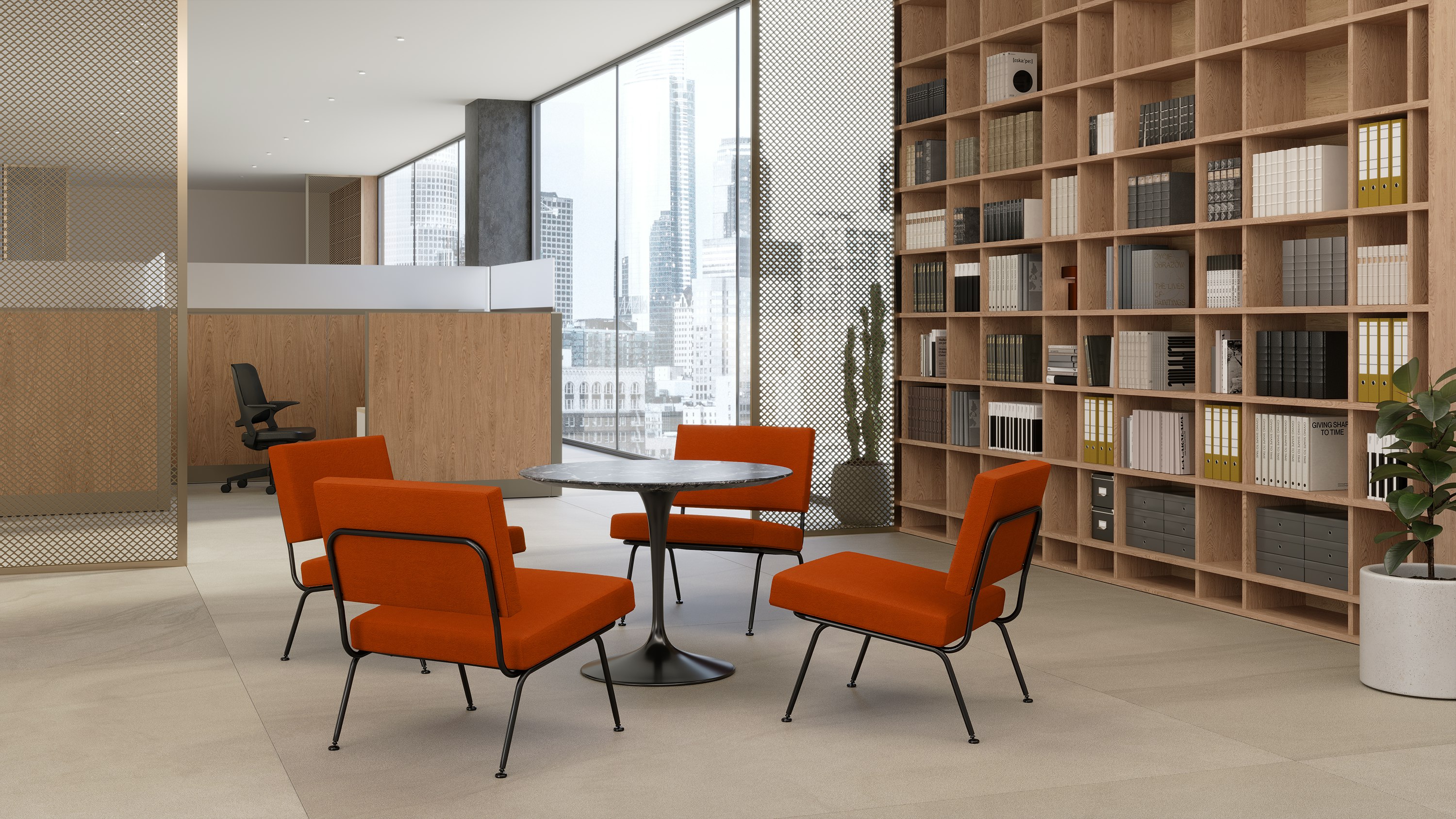 A bright break out space in an office with Florence Knoll Model 31 chairs around a Knoll Saarinen Table and Knoll Dividends Horizon in the background.