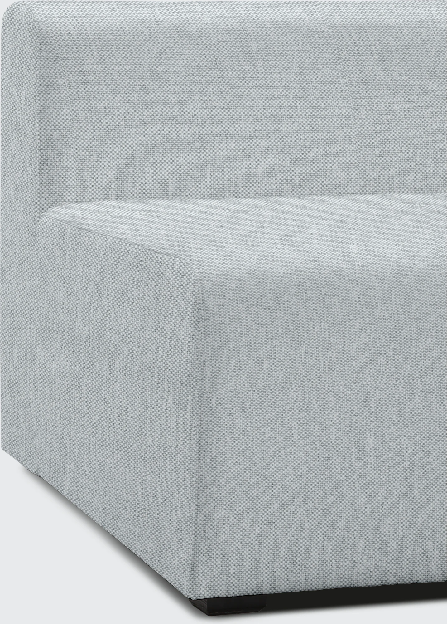 Close-up of light gray sofa upholstery and seam detailing