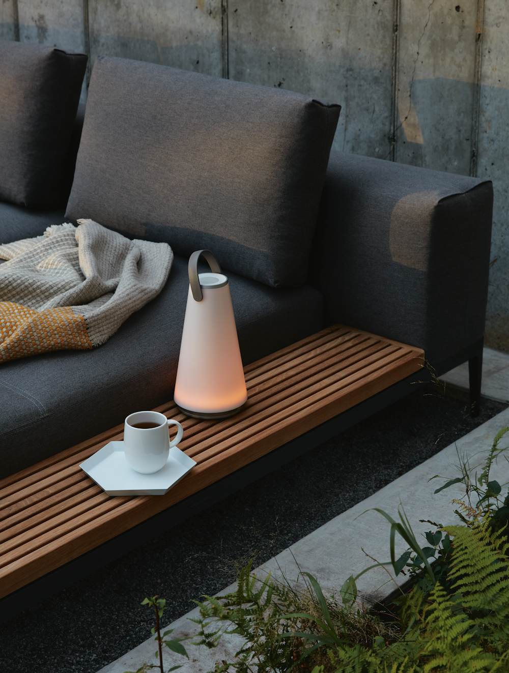 Uma Sound Lantern in an outdoor patio setting