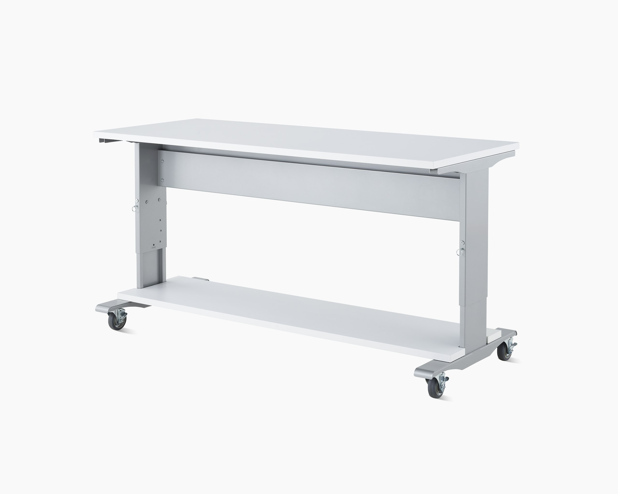 Detail of a Co/Struc System work process table in silver finish with a white top surface and a bottom reagent shelf in white.