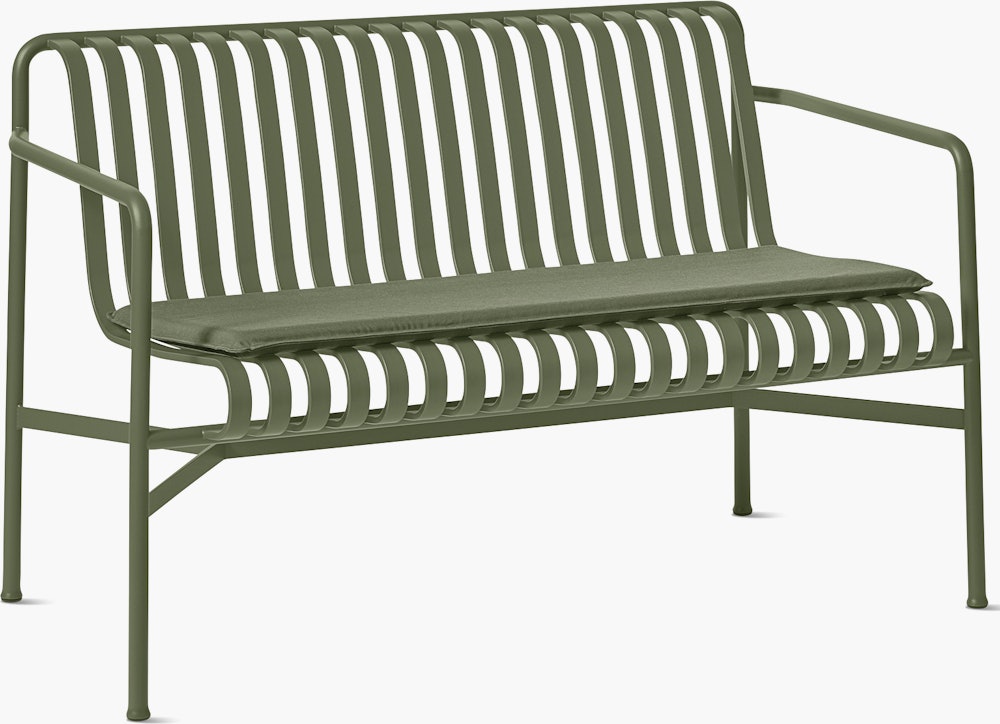 A three quarter view of a Palissade Dining Bench Seat Pad in olive green.