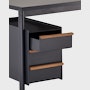 Detail view of drawers in black with walnut pulls with the top drawer open on a Mode desk.