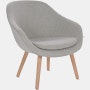 A light grey About a Lounge 82 Armchair with low back viewed from an angle