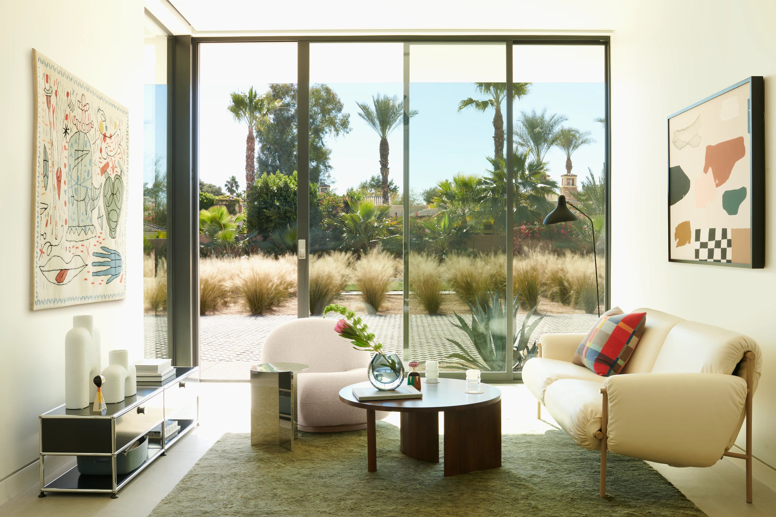 Ami Sofa, Symbol Coffee Table, USM Haller Open Media Console, Ruti Moroccan Wool Rug, Serge Mouille Floor Lamp, Slit Table, Riviera by Karina Bania, Pacha Chair, Hayon X Nani Tapestry, Cobra Vases