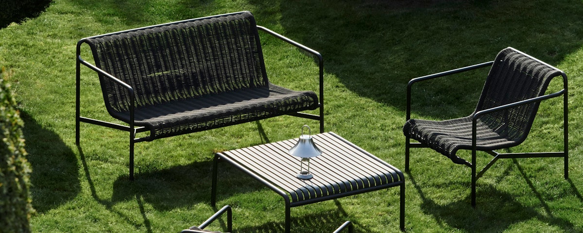 Palissade Cord Lounge Chair and Palissade Cord Lounge Sofa in a grass lawn setting