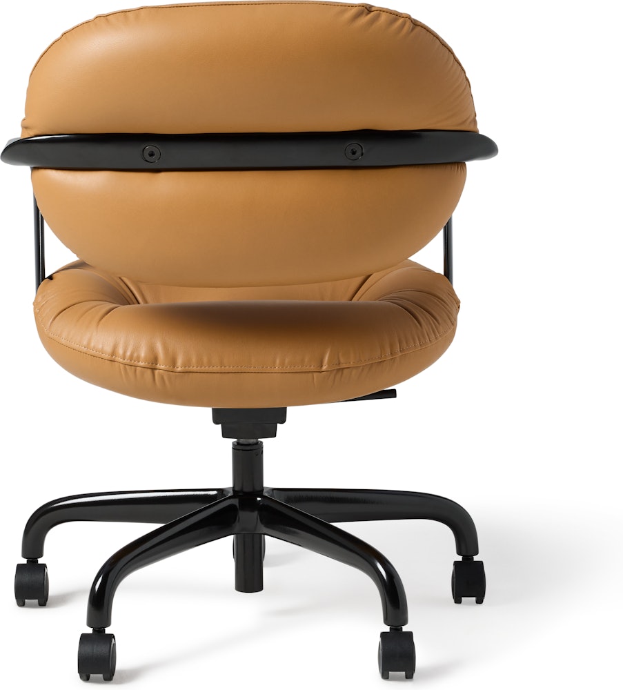 Rear view of a Morrison Hannah chair with a black frame and base with fixed arms and light brown leather upholstery.