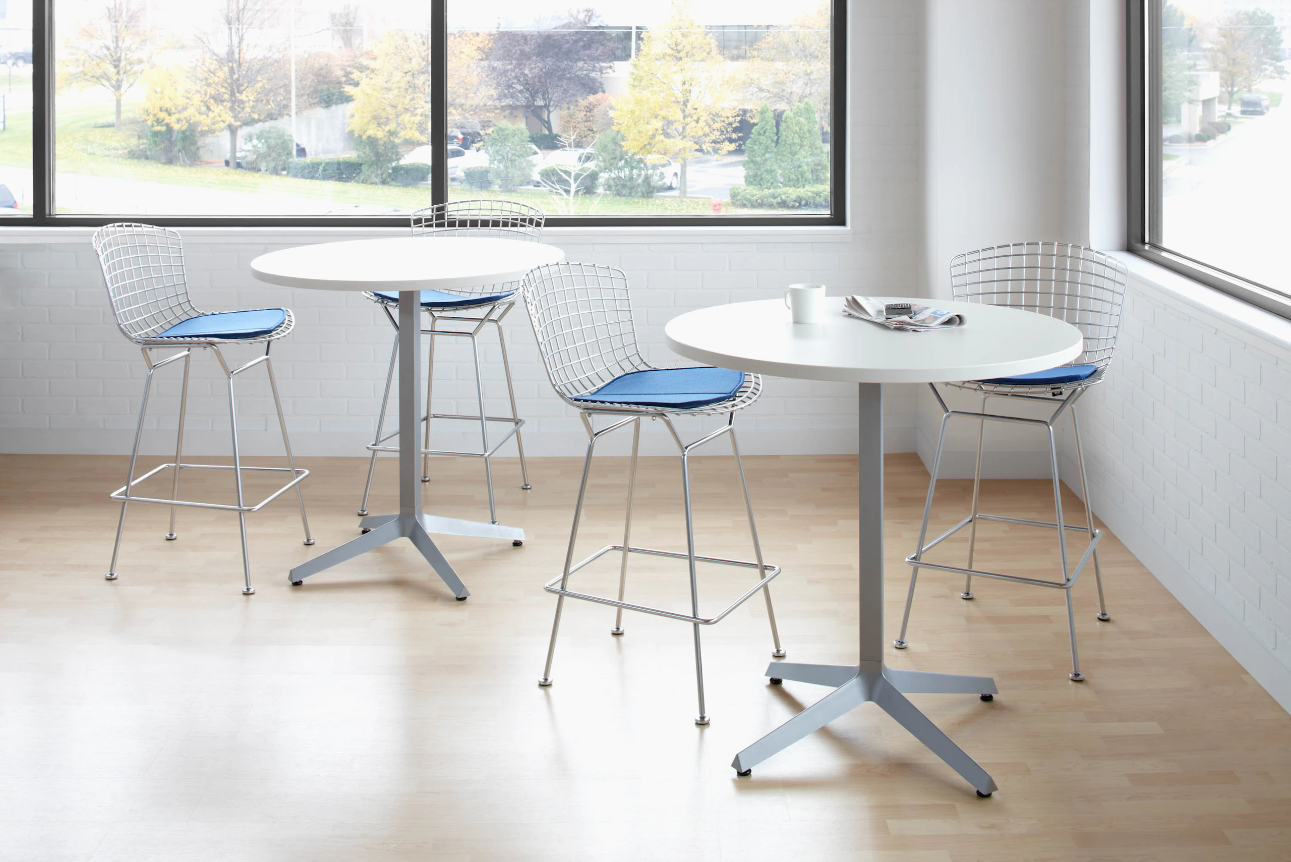 Dividends Skyline High Meeting Table with Bertoia bar stools.