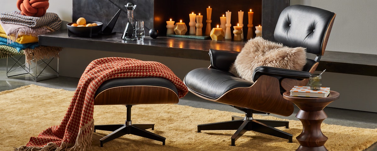 Sheepskin Pillow on an Eames Lounge Chair and Ottoman in a living room setting