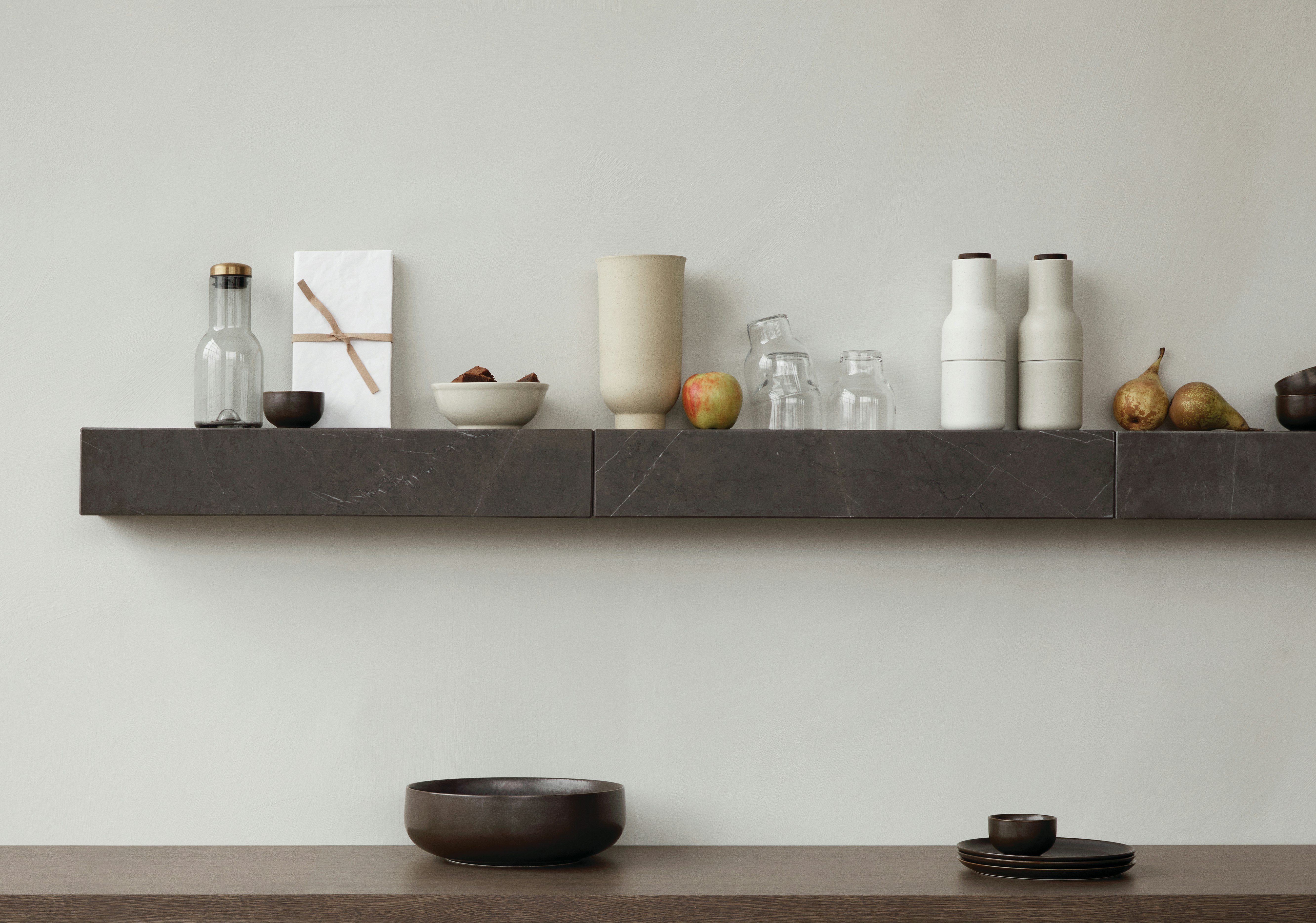 Plinth Shelf on wall holding kitchen accessories