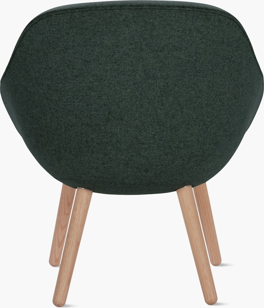 A soft green About a Lounge 82 Armchair with low back viewed from the back
