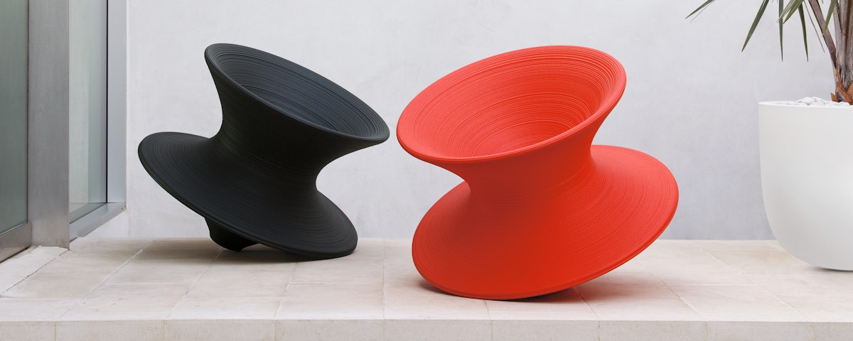 Two Magis Spun Chairs in an outdoor patio setting