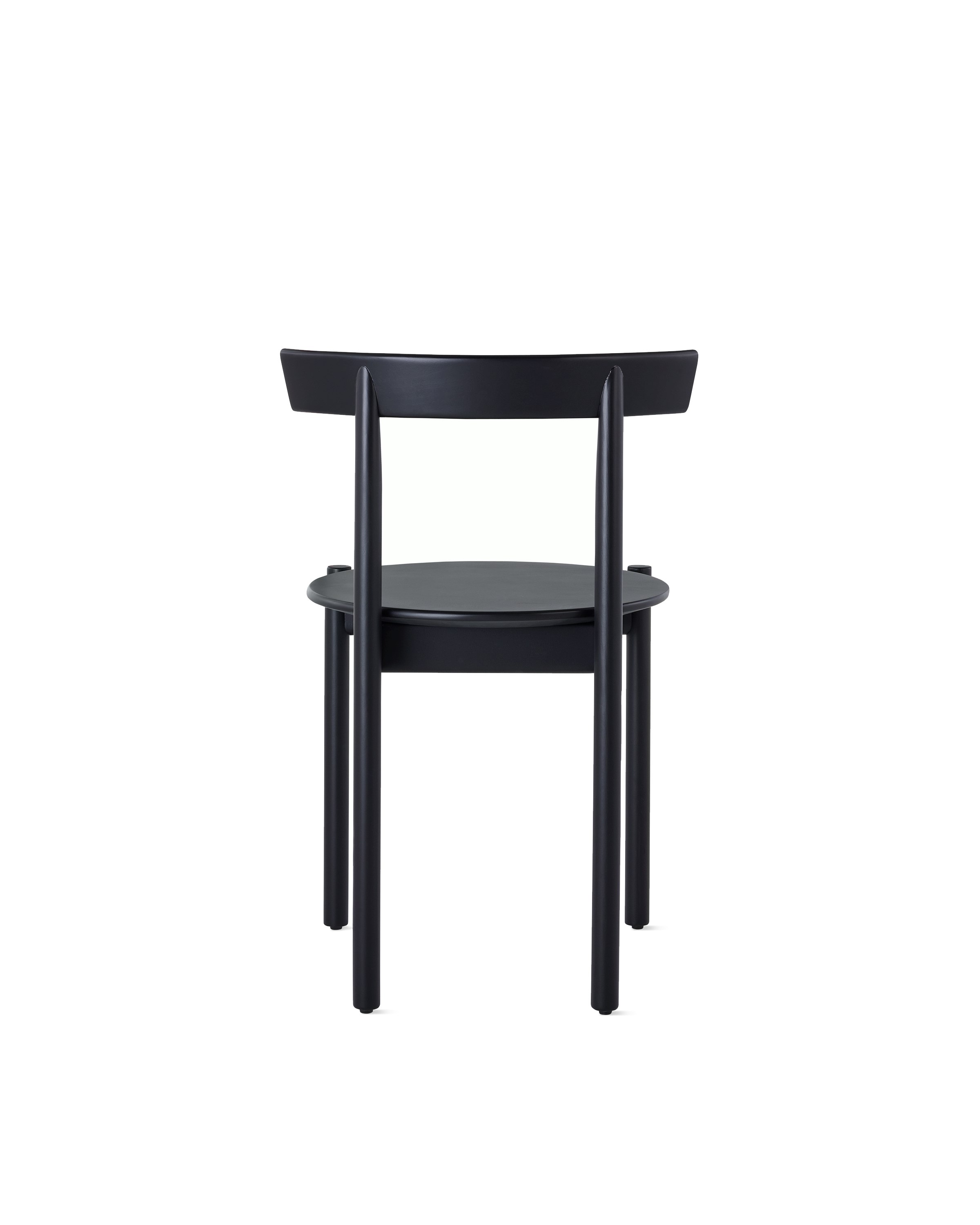 A black Comma Chair, viewed from the back.