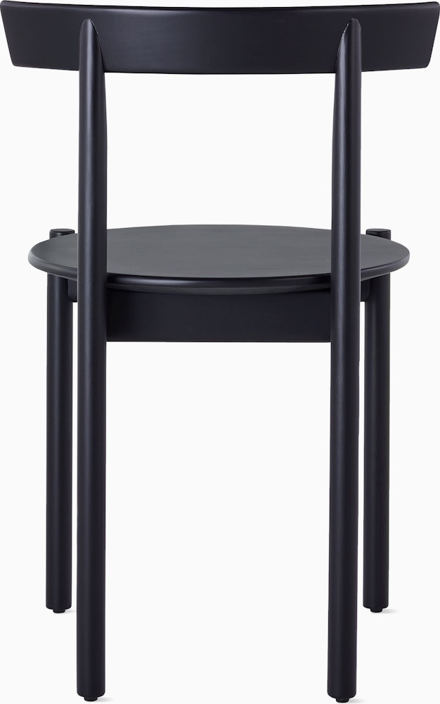 A black Comma Chair, viewed from the back.