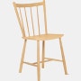 An oak J 41 Side Chair viewed from an angle