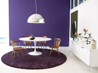 Knoll wood Straight Chair and white Saarinen Dining Table.