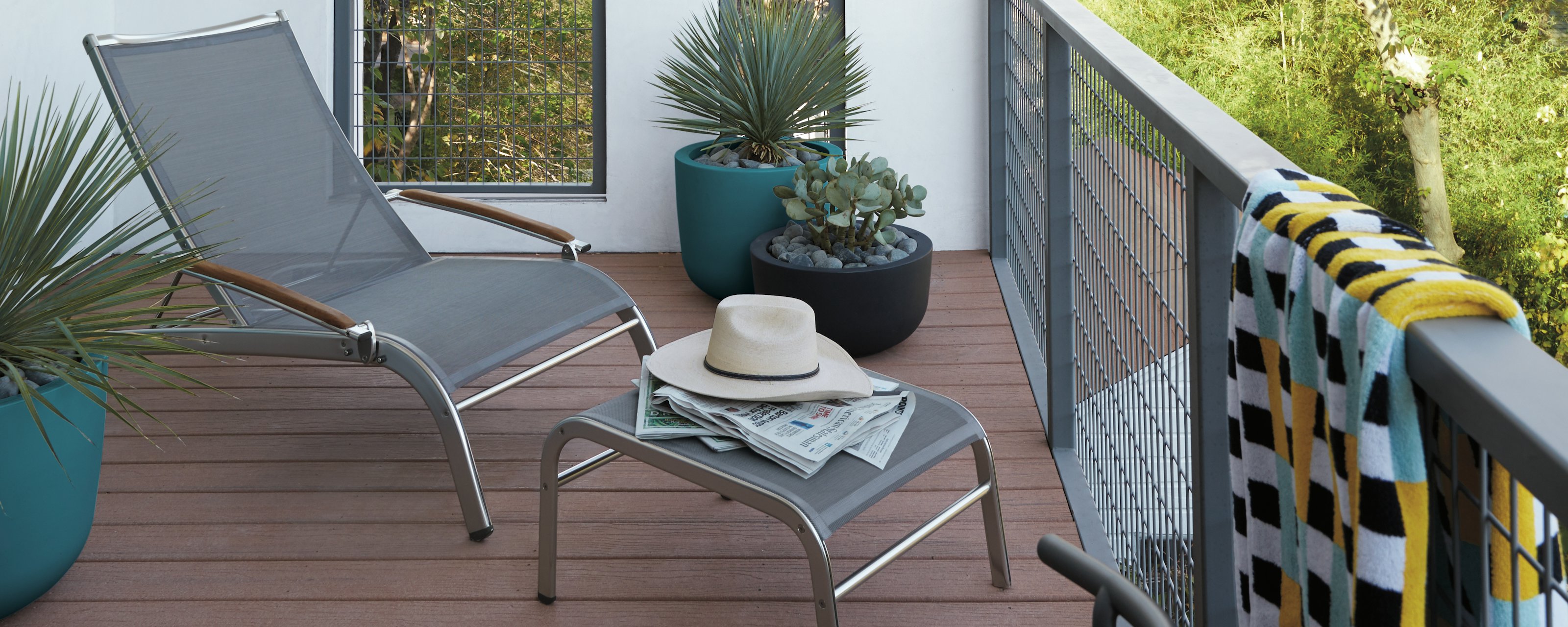 Lucca Ottoman and Lucca Lounge Chair on a deck setting
