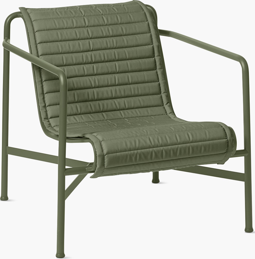 A three quarter view of a Palissade Lounge Chair Low Quilted Cushion in olive green.
