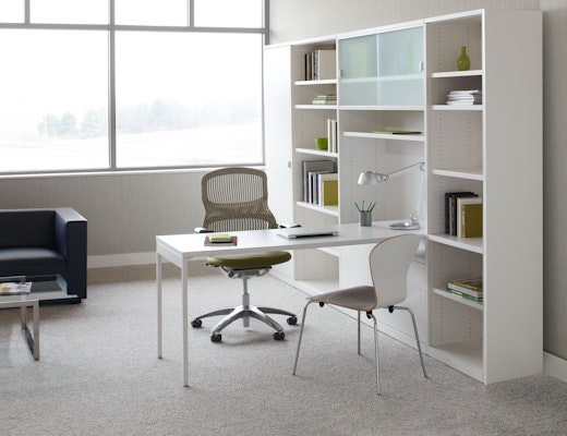 Template storage system puts the worksurface front and center, keeping active work visible and accessible.