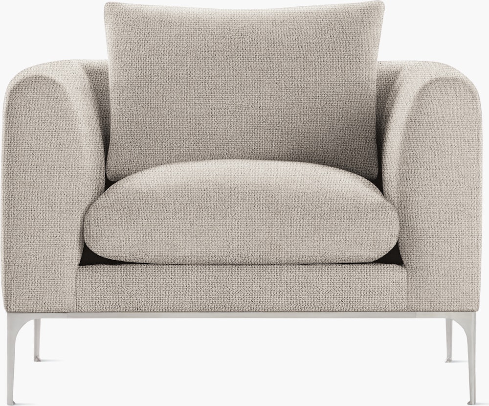 A buff Jonas Armchair with aluminum viewed from the front