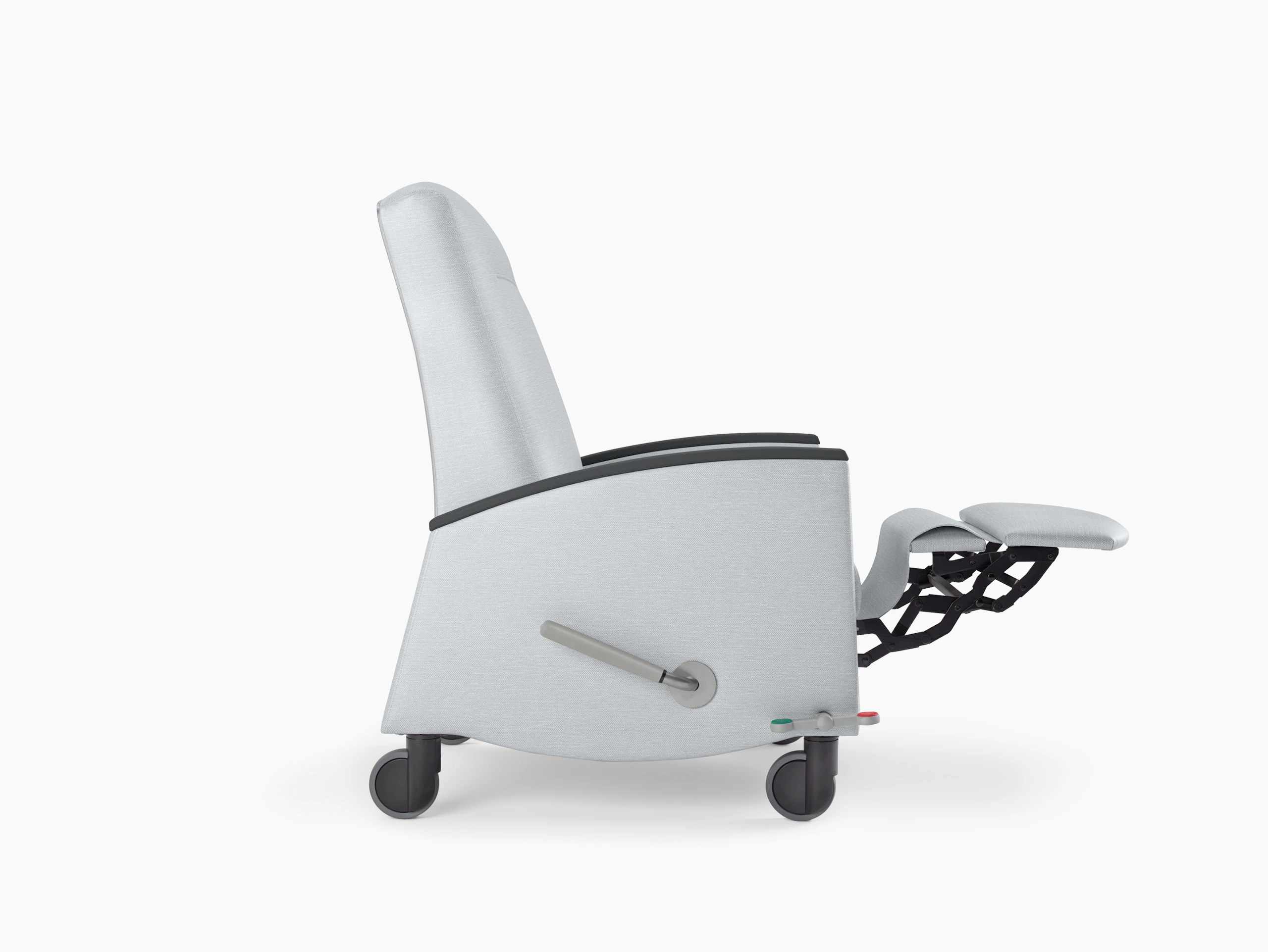 Nemschoff Sahara Recliner in a light gray upholstery and black arm caps and casters with the footrest fully extended, viewed from the side.