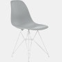 Front angle of light grey plastic shell chair on wire base.