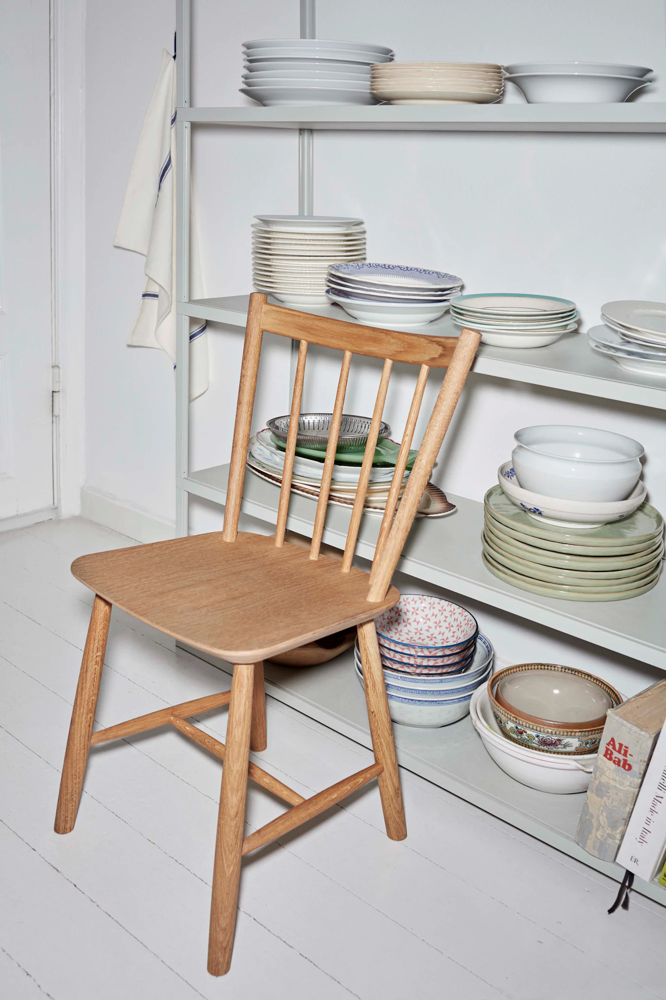 Oak J 41 side chair beside a shelf in a kitchen