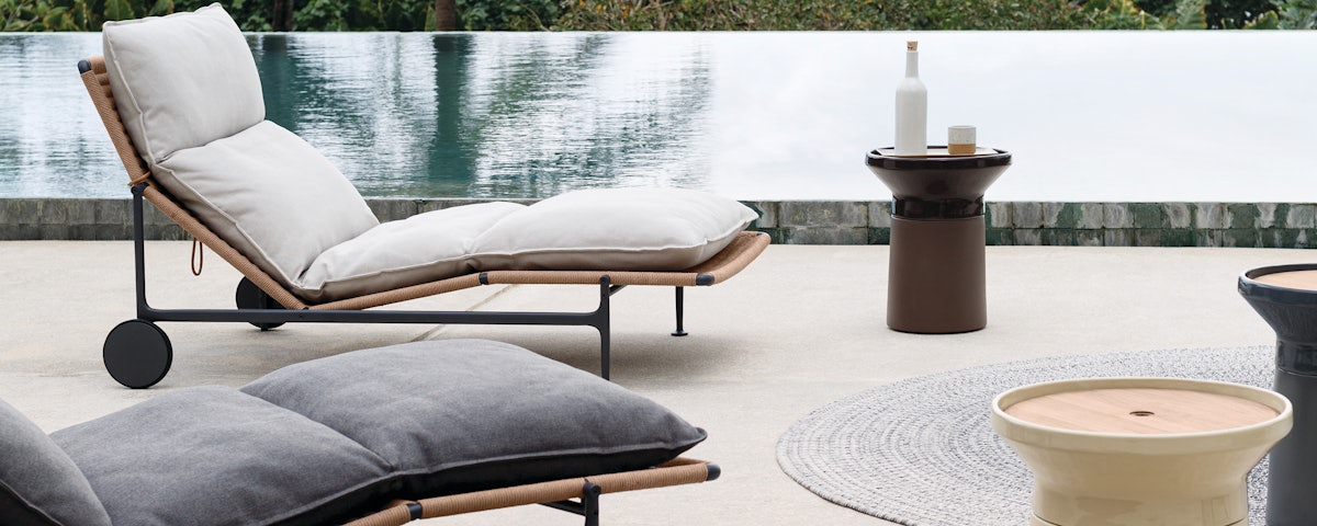 Coso Coffee Table and Coso Side Table in a poolside setting