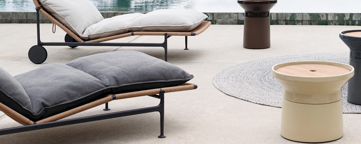 Coso Coffee Table and Coso Side Table in a poolside setting
