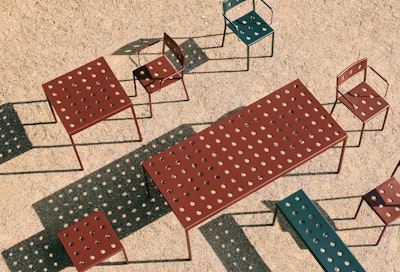 Red tables and chairs from Hay’s Balcony Collection of outdoor furniture. 